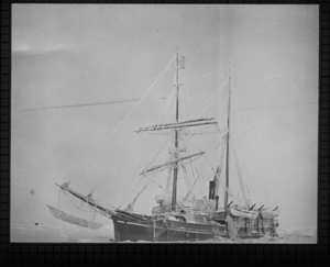 Image of The KARLUK in ice, umiak hanging from bowsprit